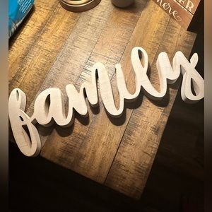 Wooden white lowercase family sign